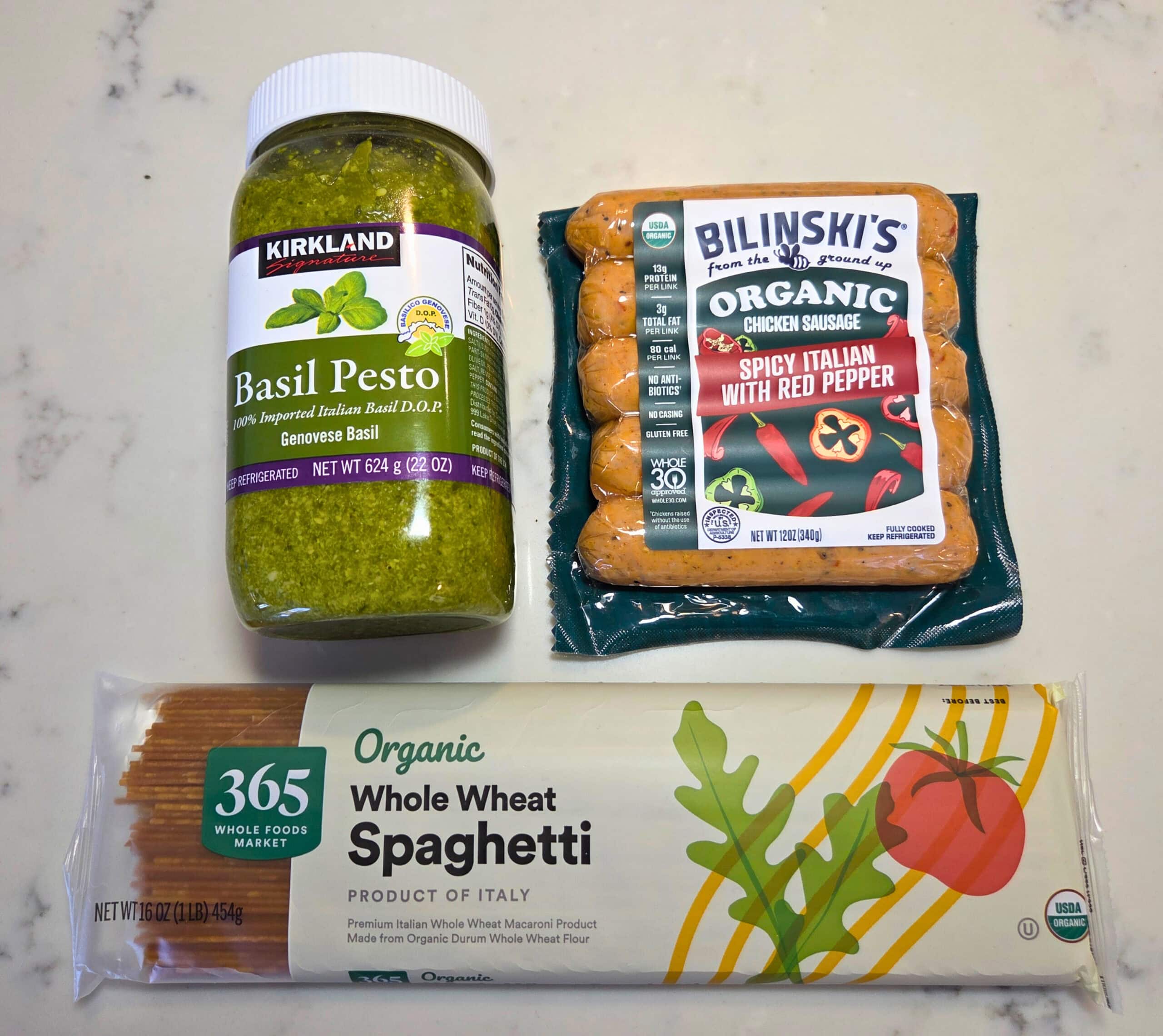 pesto, pasta, and chicken sausage ingredients