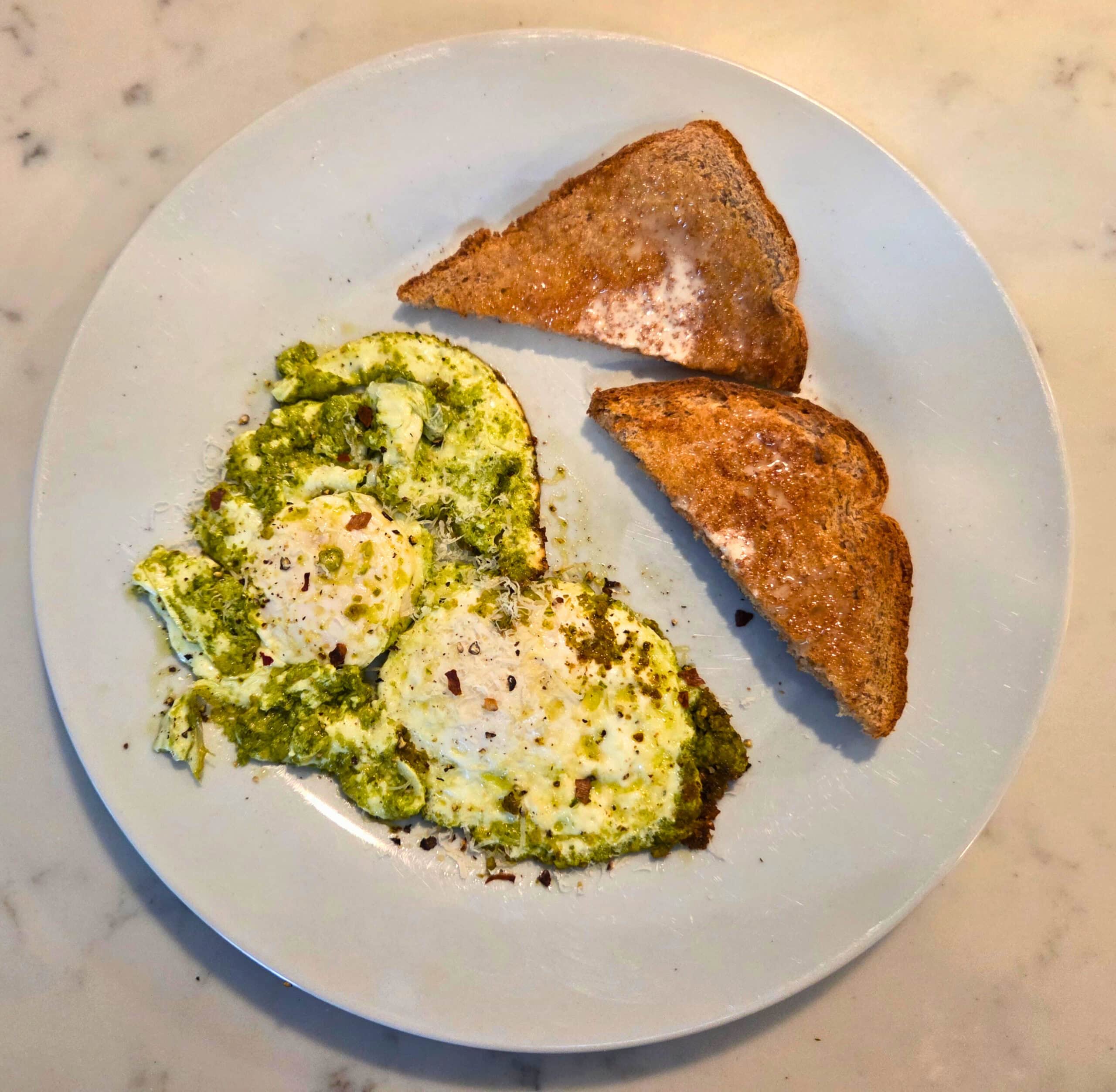 eggs fried in pesto